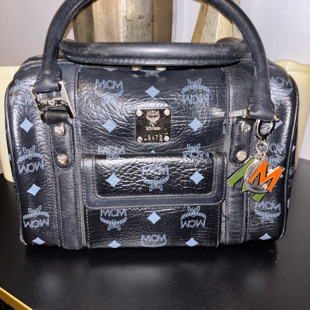 MCM Black Boston Handbag with Blueish Gray Accents and MCM Charm